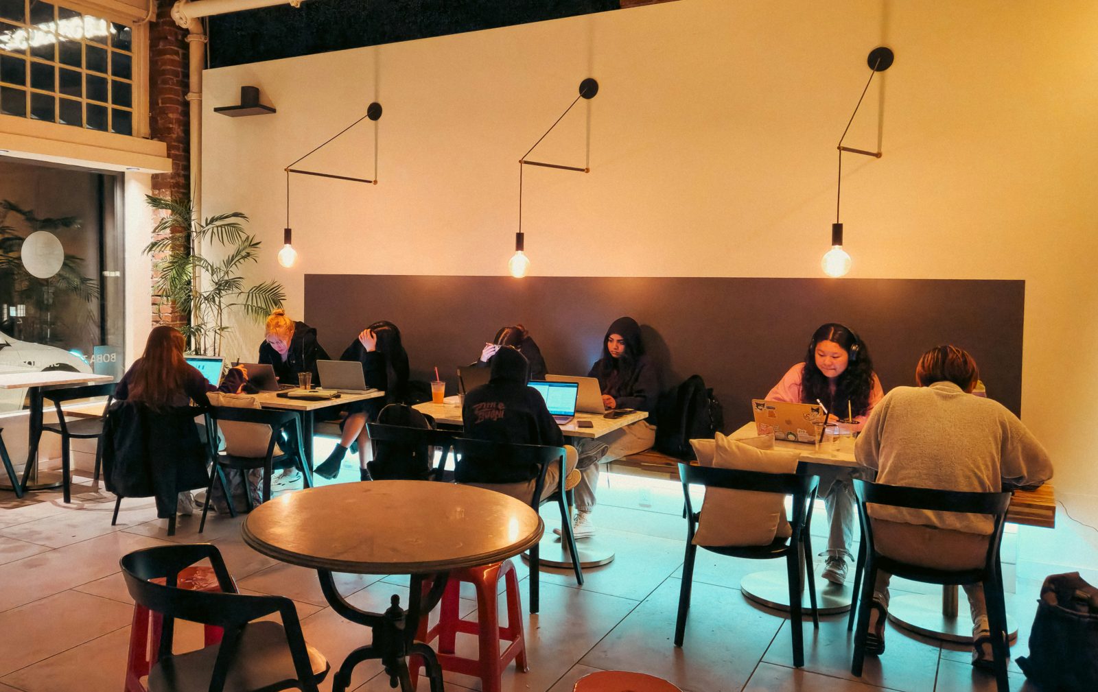 People using laptops together in a shared learning space