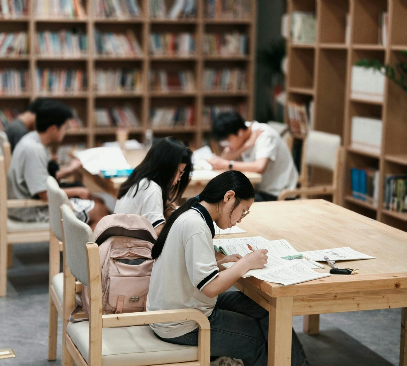 Student learning with notes and a laptop