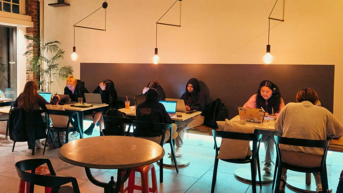 People discussing ideas and communicating in a welcoming learning environment